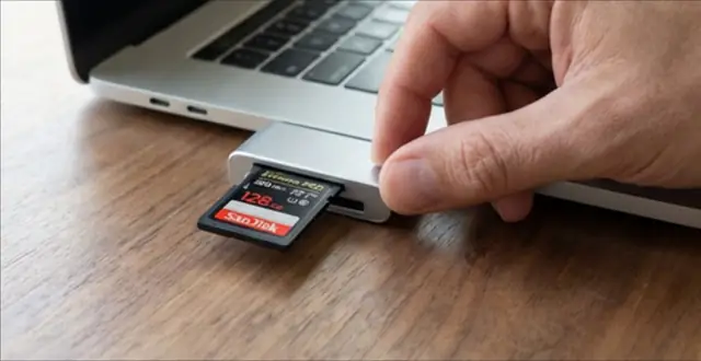Inserting a MicroSD card into a laptop card reader